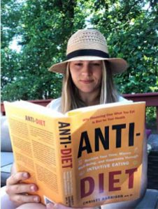 Kaitlin Eckstein reads book about Diet Culture