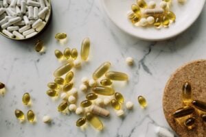 several supplement pills spread out on the counter
