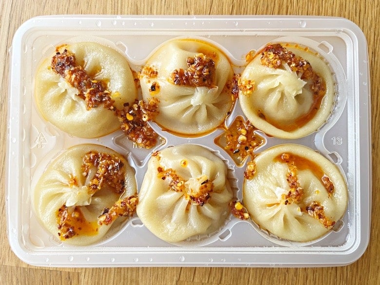 Trader joe's lunches with chicken soup dumplings topped with chili crisp
