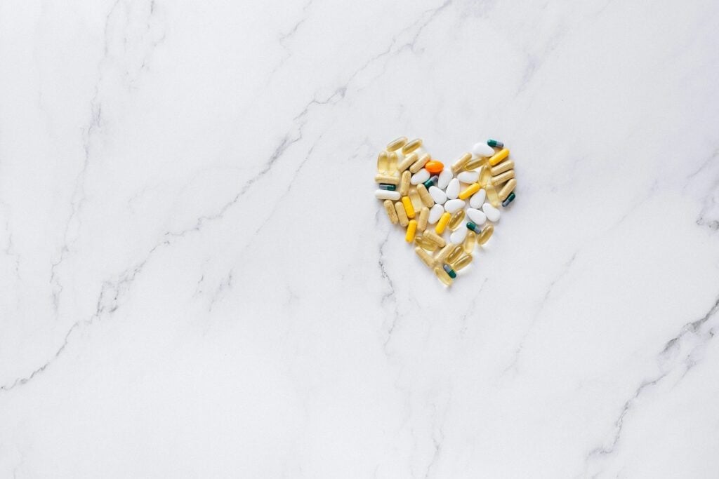 Photo by Nataliya Vaitkevich: https://www.pexels.com/photo/a-heart-shaped-pills-and-medicines-on-a-marble-surface-7615411/
