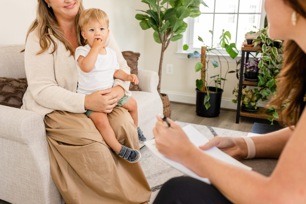 small child and parent receiving instruction from a registered dietitian